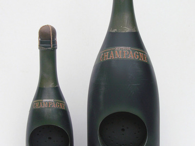 We created the CAD designs and CNC lathing of these decorative bottles made from plastic. 	