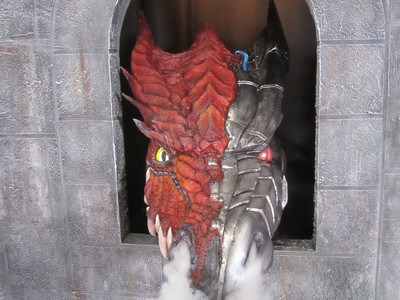 This cyborg dragon with glowing eyes and smoke effects was designed and fabricated for the Sword and Laser show on the Geek and Sundry channel. 	