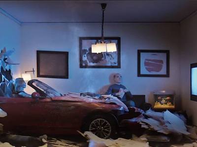 This is a 1/12 scale miniature living room car wreck scene we created with the TV lighting effect for Farmers Insurance for their Hall of Claims ad campaigns.	