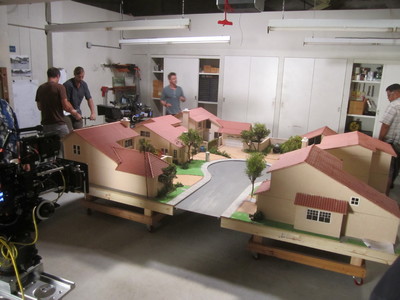 This behind the scenes shot showcases the 1/12th dollhouse scale custom houses and cul de sac miniatures we created for the TV show Cougar Town.	
