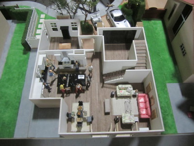 This 1/12th dollhouse scale house interior miniature is fully detailed with dressing and loads of wine for Cougar Town.	