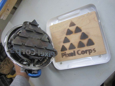 This is a custom made, water jet cut, electric branding iron for Pixel Corps to mark their gear with. 	